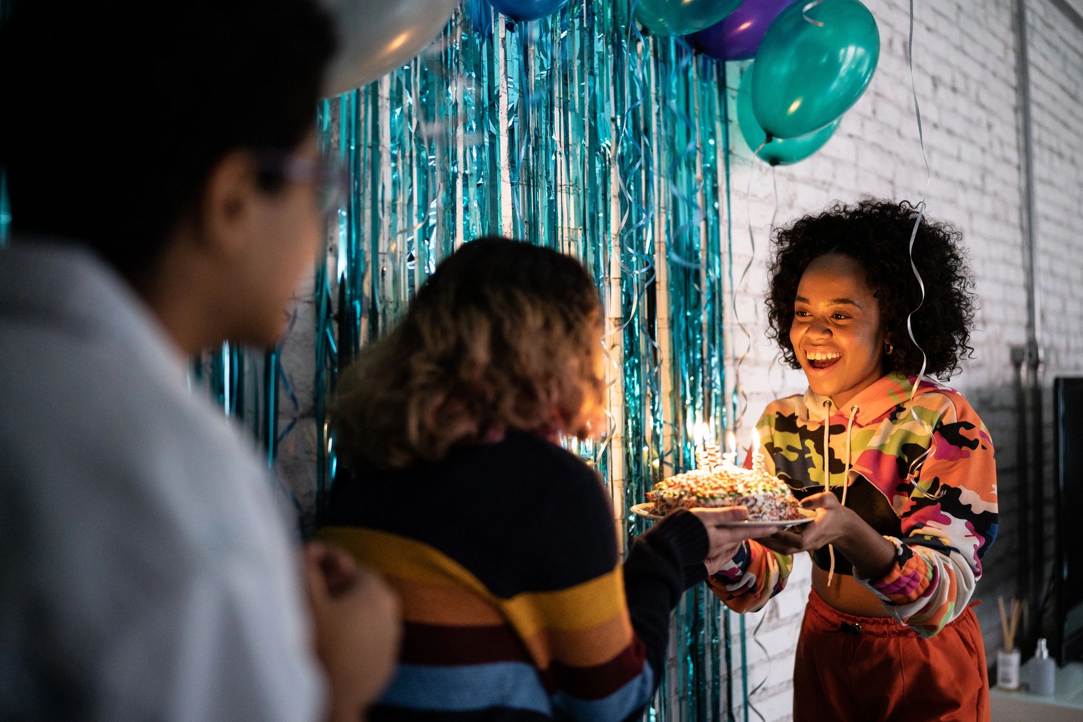 Friends celebrating a birthday at home