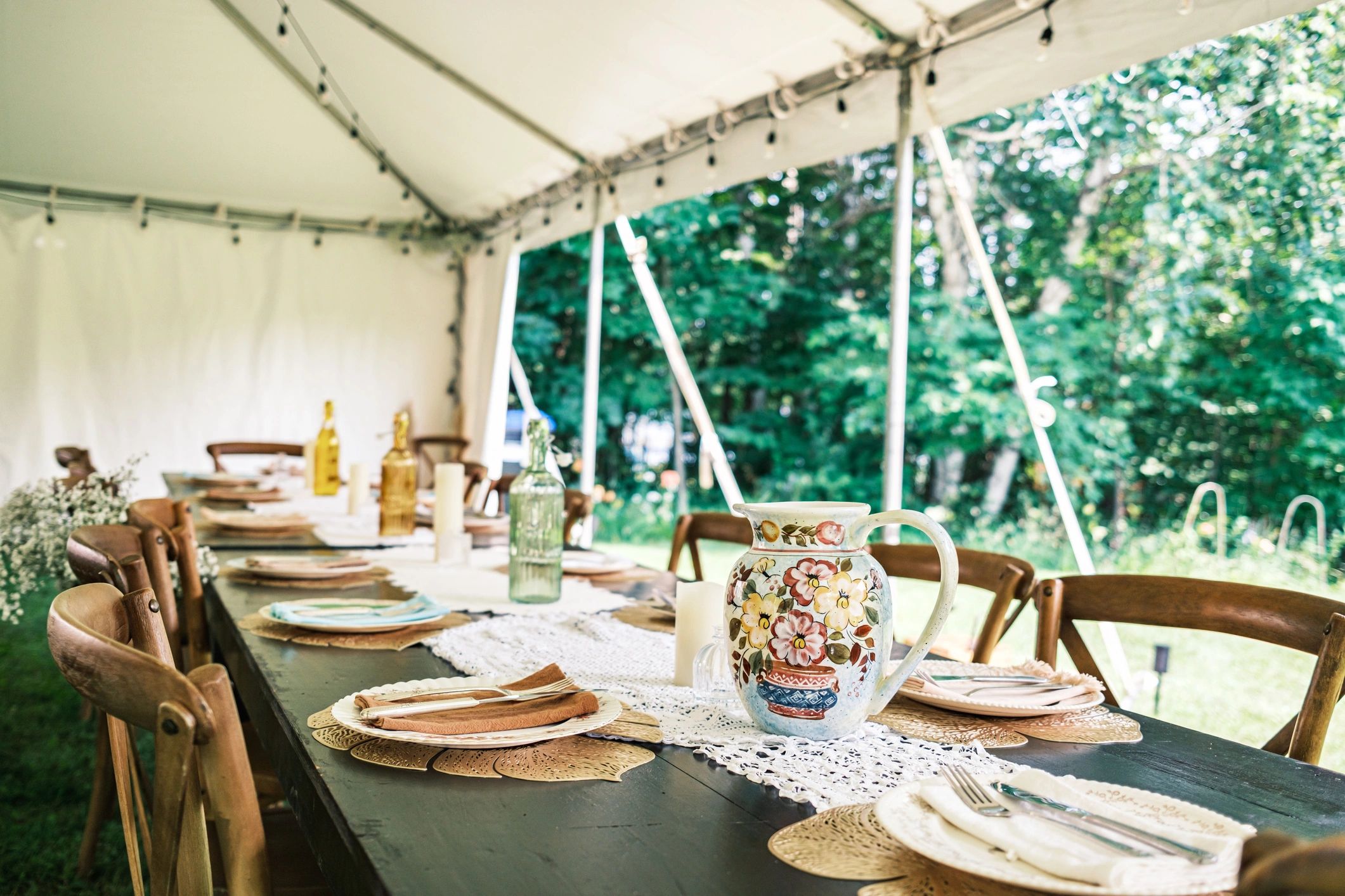 Wedding table setting inside a tent