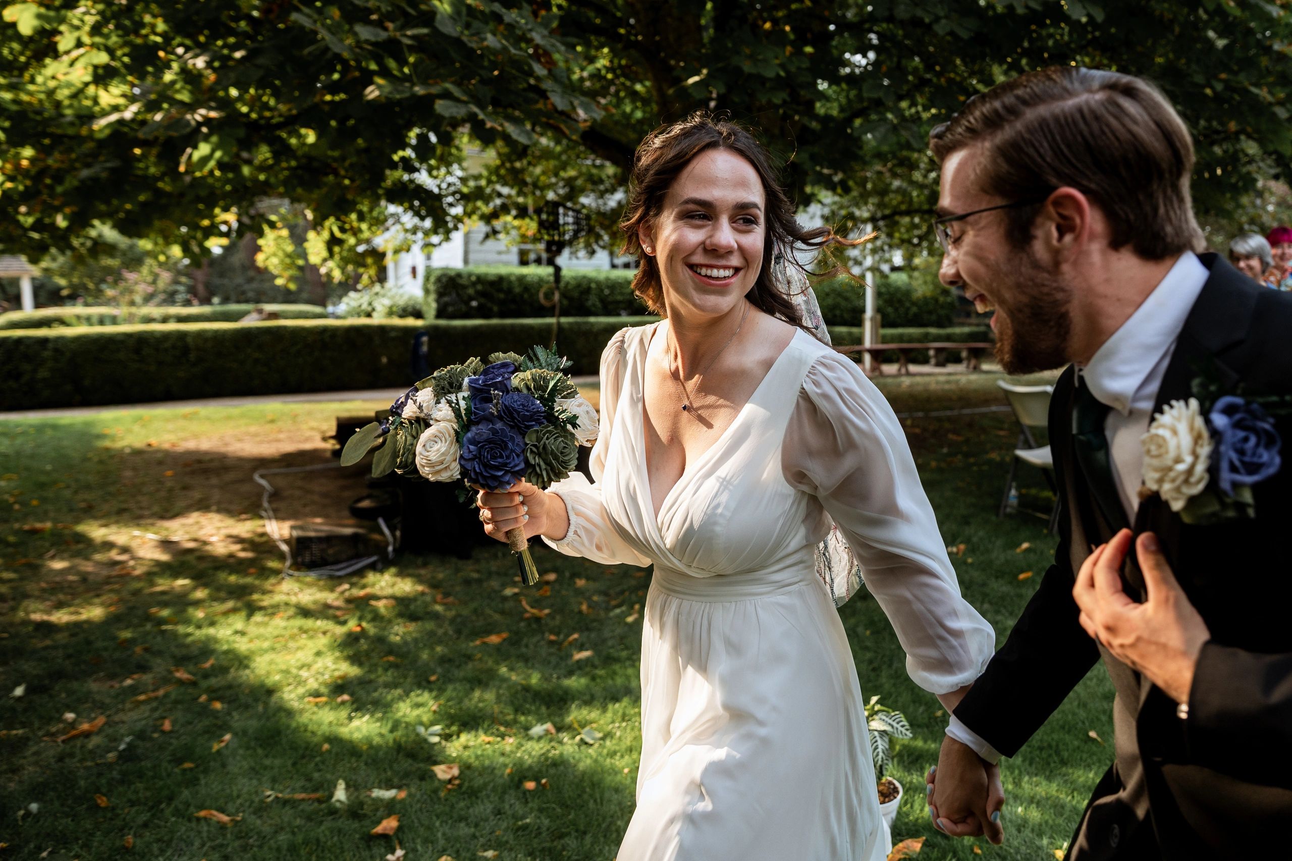 Bride and groom exchanging vows outdoors