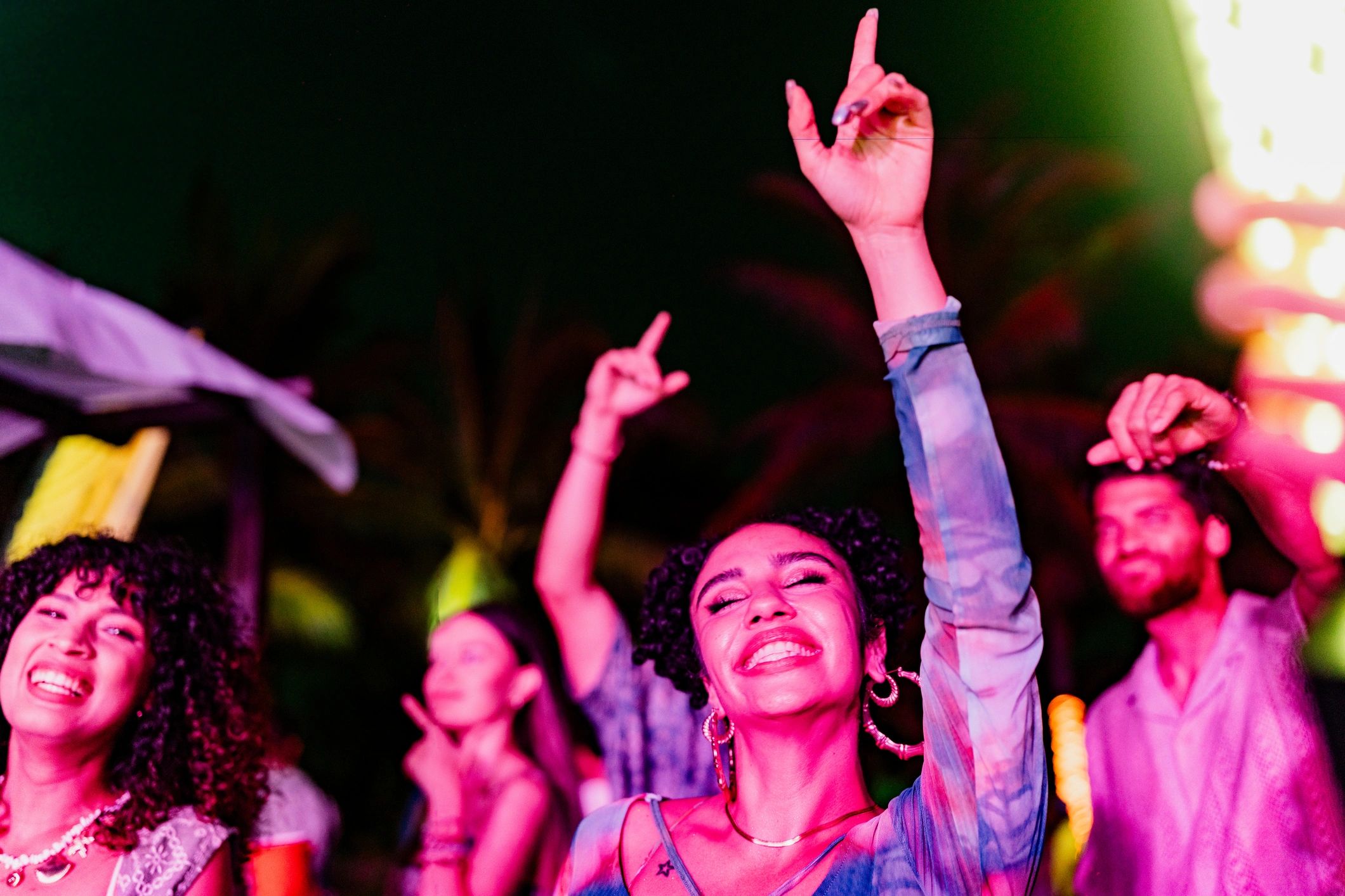 Friends dancing at an outdoor party