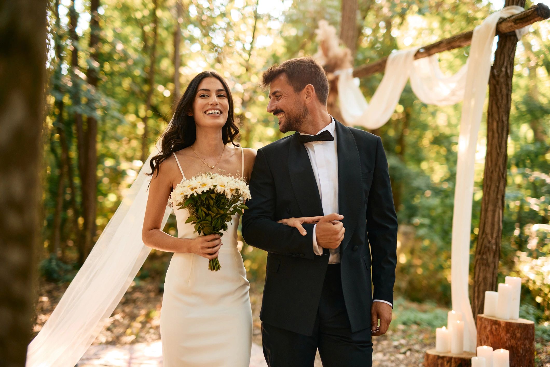 Bride and groom walking down the aisle outdoors