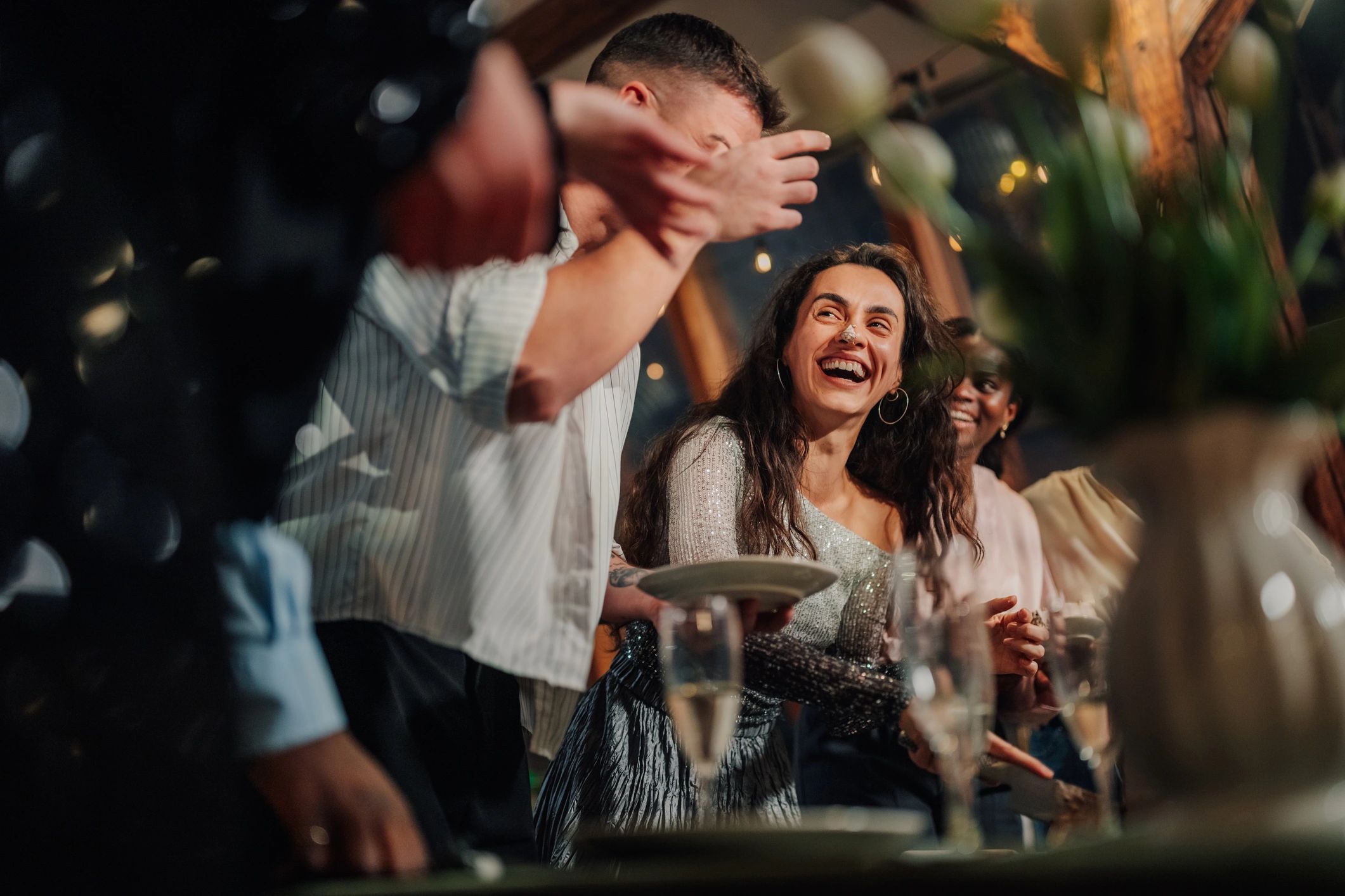 Guests enjoying a lively celebration at an indoor event
